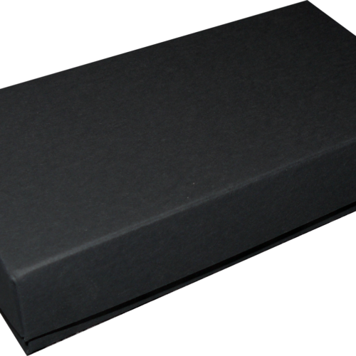 Black rectangular box with a lid, closed, photographed from an angled perspective.